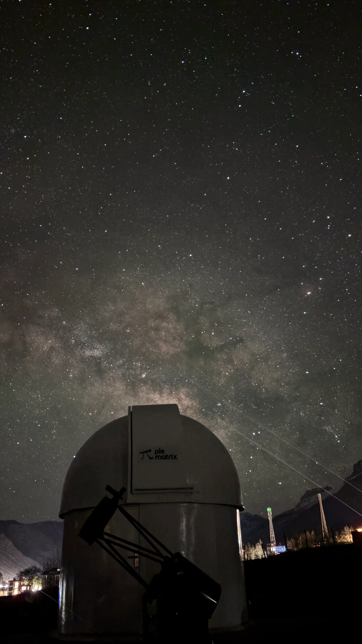 No moon. The Milky Way stands up over the dome.