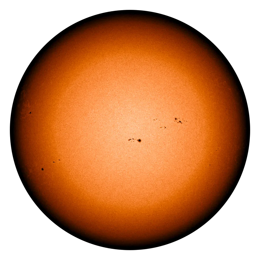 The Sun through a solar filter: an orange disc with small dark sunspots